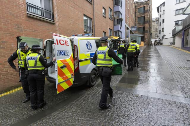 Police officers attend the SNP's headquarters in Edinburgh. Picture: Robert Perry/Getty Images