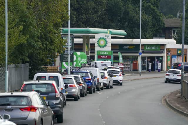 Cars queue for fuel at a BP petrol station in Bracknell, Berkshire, on Sunday. Picture: Steve Parsons/PA Wire