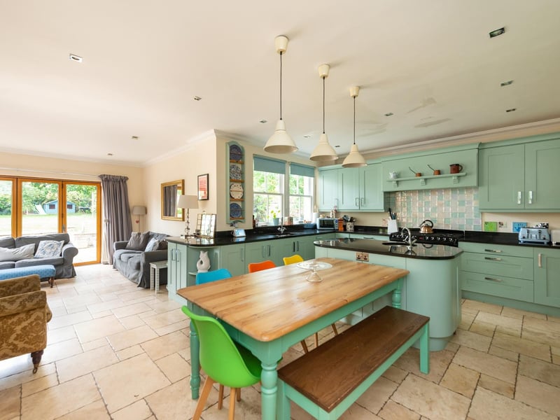 Interior: A formal lounge and dining room are to the front of the property, while an open-plan family and kitchen with handmade units, Aga and island sit to the rear. The master bedroom is ensuite and has a dressing room.