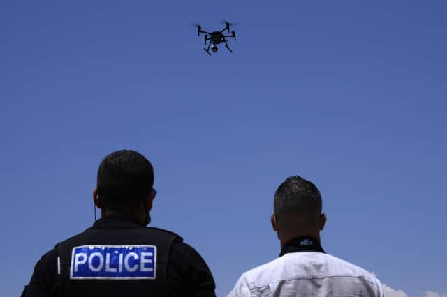 The use of drones and other forms of technology to monitor the public raise serious questions about human rights (Picture: Petros Karadjias/AP)