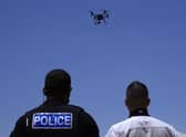 The use of drones and other forms of technology to monitor the public raise serious questions about human rights (Picture: Petros Karadjias/AP)