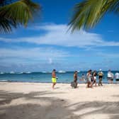 Tourists enjoy a beach in Punta Cana in the Dominican Republic.