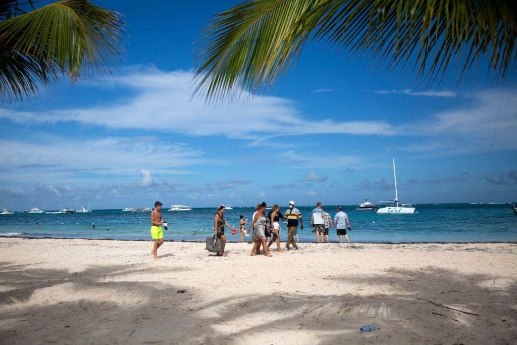 Tourists enjoy a beach in Punta Cana in the Dominican Republic.