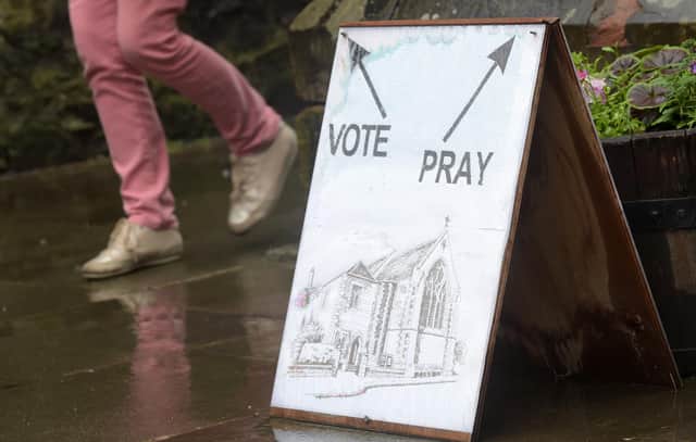 Voters would be required to show photographic identification if new laws are passed (Picture: Lesley Martin/AFP via Getty Images)