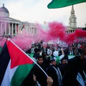 People at a rally in Trafalgar Square, London, during Stop the War coalition's call for a Palestine ceasefire.