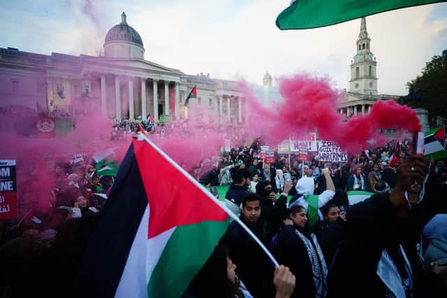 People at a rally in Trafalgar Square, London, during Stop the War coalition's call for a Palestine ceasefire.
