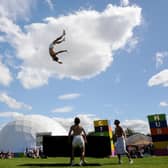 An acrobat from La Meute flies over the Circus Hub, the much-loved Fringe venue in the Meadows. Picture: Jane Barlow