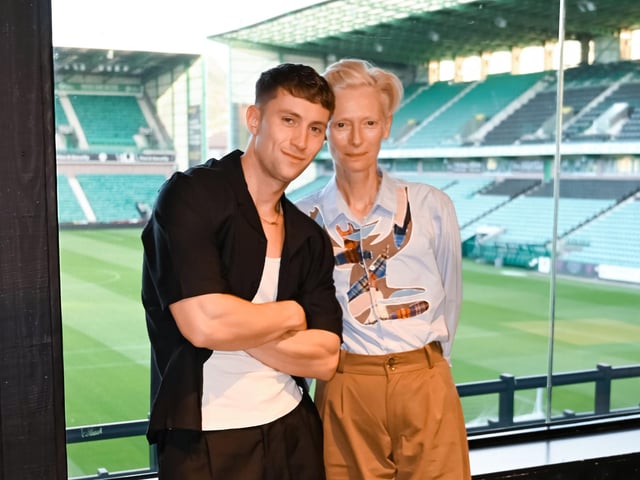 Alfie Cain with Tilda Swinton in the bar at Hibernian Football Club's Behind the Goals venue