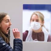 Swab testing as previously done by Edinburgh university students. The new tests will use saliva samples.