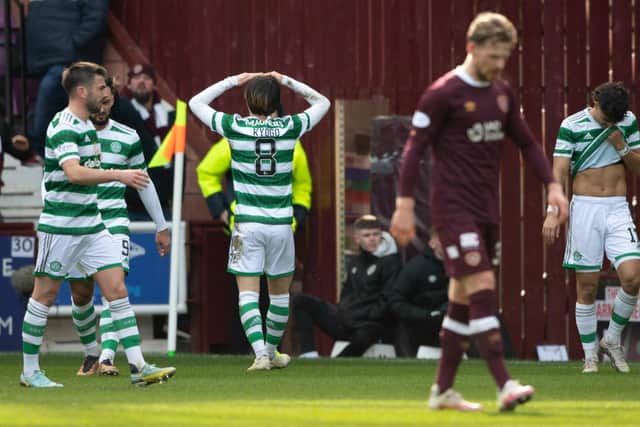 Stephen Kingsley's dejected outlook sums up Hearts day as Celtic celebrate.