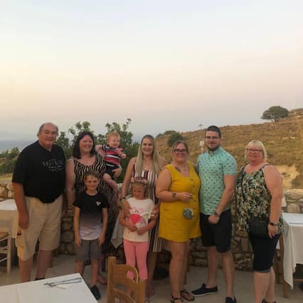 Father-of-three Ian Robertson on holiday with family in Kos, Greece, shortly before the accident.