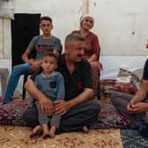 DEC Chief Executive Saleh Saeed meets Zeynep and Mehmet's family who have received cash payments through the British Red Cross as he visits the earthquake response near Gaziantep, Turkey in July.