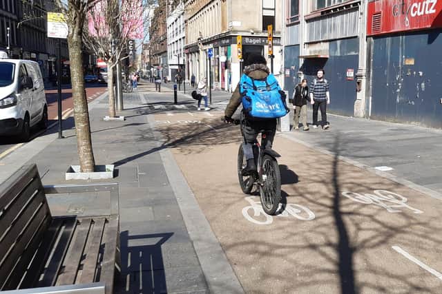 Many cyclists find riding on segregated lanes preferable to sharing roads with other traffic, like this one on Sauchiehall Street in Glasgow. Picture: The Scotsman