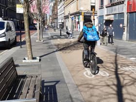 Many cyclists find riding on segregated lanes preferable to sharing roads with other traffic, like this one on Sauchiehall Street in Glasgow. Picture: The Scotsman