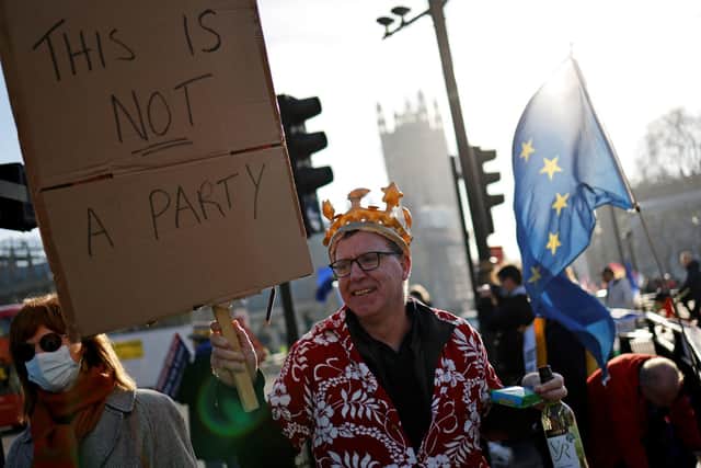 Protesters make a point outside the House of Commons after it was revealed that Boris Johnson attended a party in the garden at 10 Downing Street (Picture: Tolga Akmen/AFP via Getty Images)