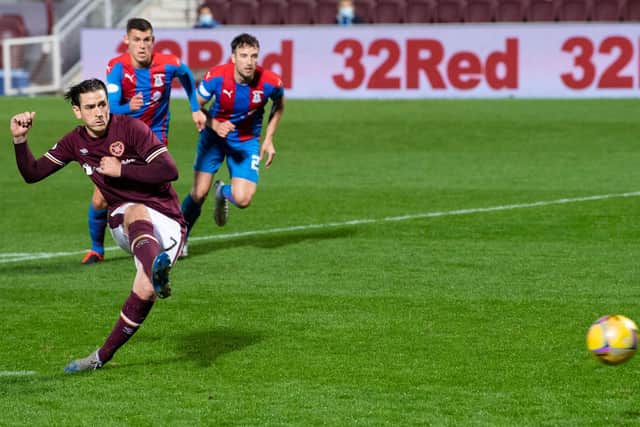Jamie Walker's penalty was enough for Hearts to beat Inverness.