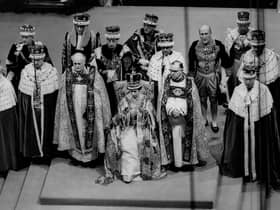 Queen Elizabeth II sits on a throne during her coronation in Westminster Abbey in 1953 (Picture: Central Press Photo Ltd/AFP via Getty Images)