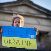 People gather for the Standing In Solidarity With Ukraine vigil on The Mound, Edinburgh, following the Russian invasion of Ukraine. Picture date: Tuesday March 1, 2022.