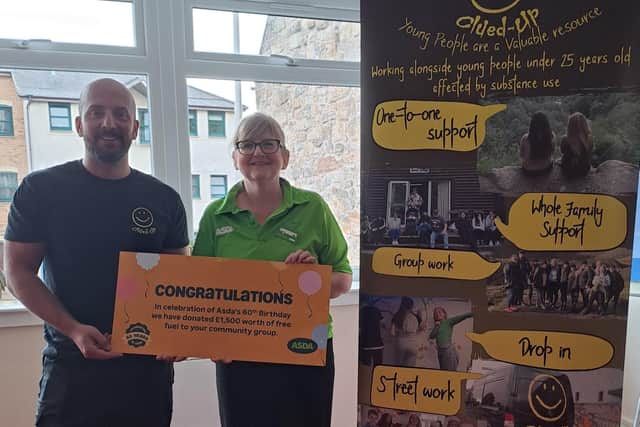 Asda Kirkcaldy surprises Clued Up Project with a lucky golden ticket for £1,500 worth of free fuel. Pictured L-R: Stevan Sutherland, Team Leader at Clued Up Project; Jean Ritchie, Community Champion, Asda Kirkcaldy
