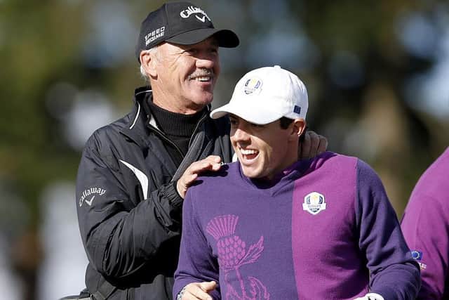 Rory McIlroy shares a joke with coach Pete Cowen during a practice round ahead of the 2014 Ryder Cup at Gleneagles. Picture: Adrian Dennis/AFP via Getty Images.