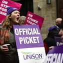 Members of UNISON and UCU on a picket  line outside Glasgow School of Art.