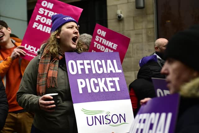 Members of UNISON and UCU on a picket  line outside Glasgow School of Art.