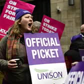 Members of UNISON and UCU on a picket  line outside Glasgow School of Art.