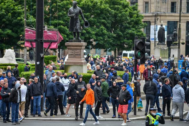 A large number of people gathered in George Square, Glasgow. The Loyalist Defence League earlier asked followers to gather over the weekend for a 'protect the Cenotaph' event in response to statues being defaced across Scotland following Black Lives Matter demonstrations. (Photo by Jeff J Mitchell/Getty Images)