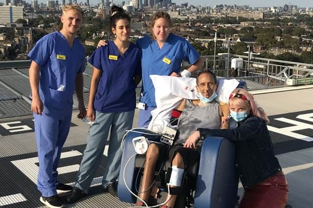 Jim Ashworth-Beaumont on the helipad with one of the 12 medical teams that looked after him