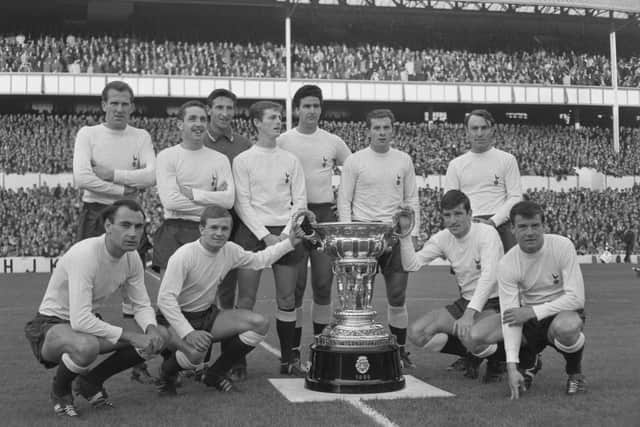 The Tottenham Hotspur team pose with the Trofeo Costa del Sol trophy - won in pre-season in Spain - in August 1965. Alan Gilzean is bottom left, Jimmy Greaves top right. (Photo by Victor Blackman/Express/Hulton Archive/Getty Images)