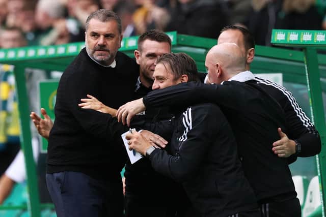 Celtic manager Ange Postecoglu celebrates with backroom staff after his side take the lead against St Mirren. (Photo by Craig Williamson / SNS Group)
