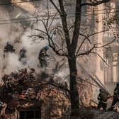 Ukrainian firefighters work on a destroyed building after several drones hit Kyiv on Monday (Picture: Yasuyoshi Chiba/AFP via Getty Images)