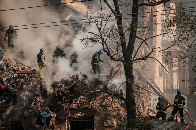 Ukrainian firefighters work on a destroyed building after several drones hit Kyiv on Monday (Picture: Yasuyoshi Chiba/AFP via Getty Images)
