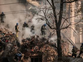 Ukrainian firefighters work on a destroyed building after several drones hit Kyiv on Monday (Picture: Yasuyoshi Chiba/AFP via Getty Images)