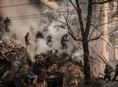 Ukrainian firefighters work on a destroyed building after several drones hit Kyiv on Monday (Picture: Yasuyoshi Chiba/AFP via Getty Images)
