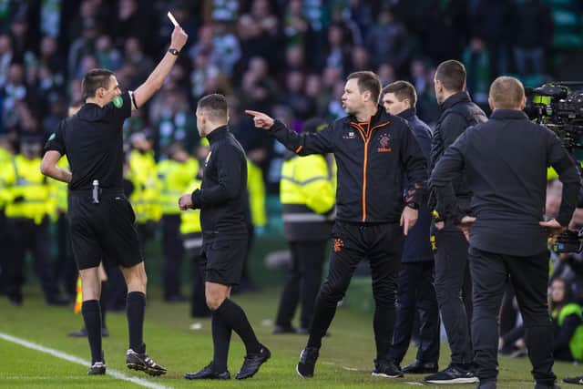 Referee Kevin Clancy sends off Rangers first team coach Michael Beale (right) during a derby in 2019.