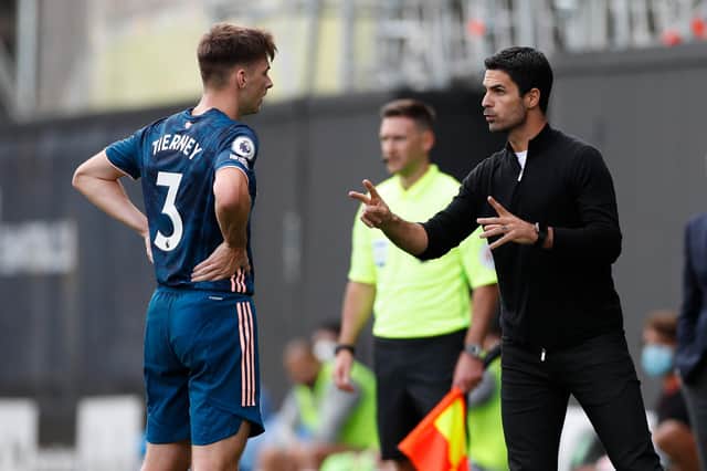 Gunners manager Mikel Arteta talks with Arsenal's defender Kieran Tierney (Photo by PAUL CHILDS/POOL/AFP via Getty Images)