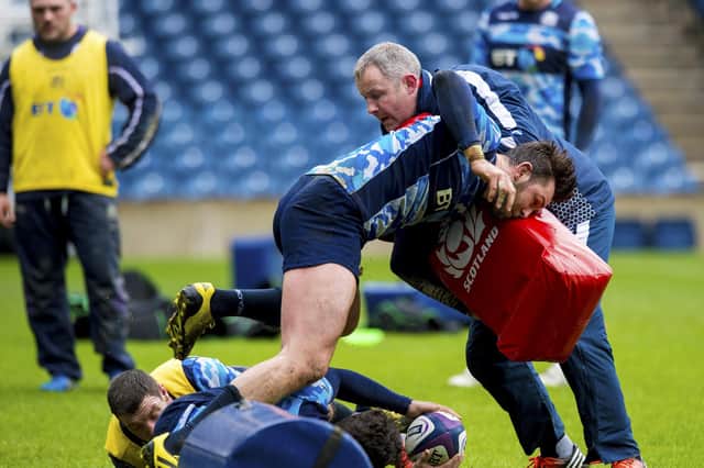 Richie Gray, right, takes part in a tackling drill during his time as Scotland coach.