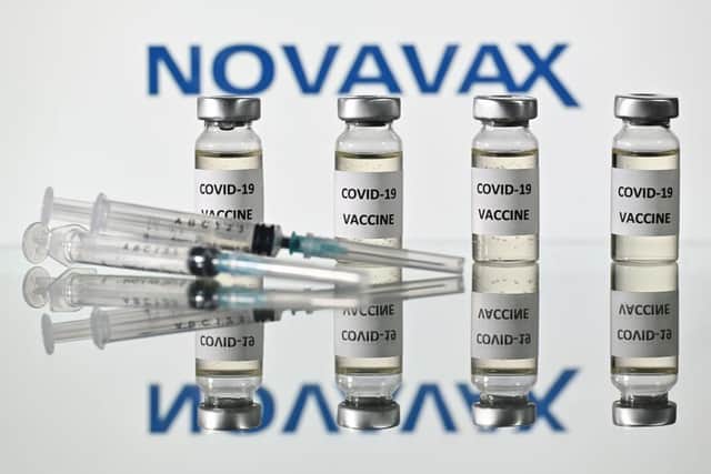 An illustration picture shows vials with Covid-19 Vaccine stickers attached and syringes with the logo of US biotech company Novavax (Photo: JUSTIN TALLIS/AFP via Getty Images).