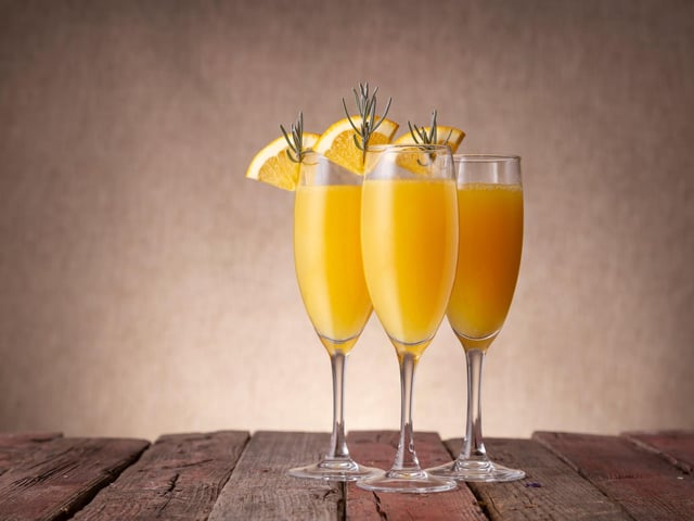 It doesn't get any easier than making a Mimosa - simply half fill a champagne glass with sparkling wine, then add orange juice until the glass is full. No garnish is needed - but you can also ways pop a slice of orange on the rim.