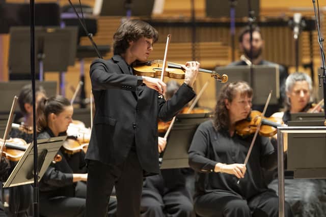 Daniel Lozakovich performing with the BBC SSO