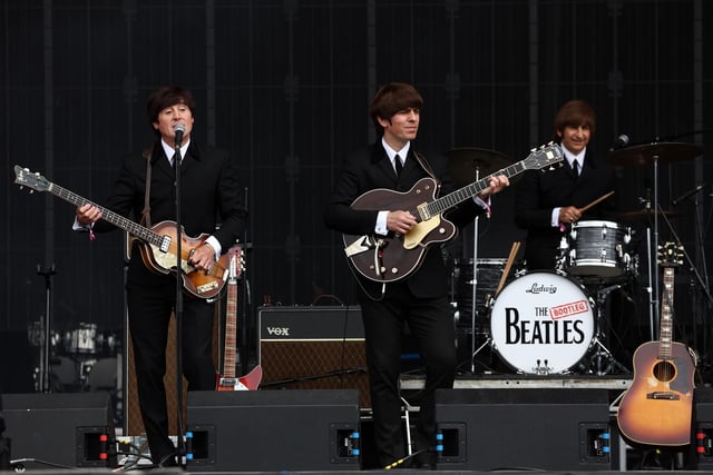 The Bootleg Beatles perform (Photo by Jeff J Mitchell/Getty Images)