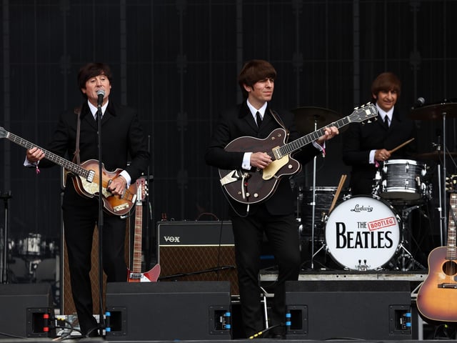 The Bootleg Beatles perform (Photo by Jeff J Mitchell/Getty Images)