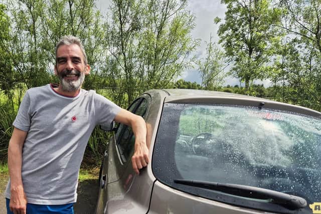 Fraser Thomson and the motor which will be rammed to the rafters with equipment as he heads to Harris and the five-star Amhuinnsuidhe Castle Estate, where he will be working for two months as a ghillie. Picture: Nigel Duncan