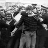 Police restrain picketers outside a pit during the miners' strike in the 1980s