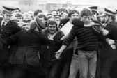 Police restrain picketers outside a pit during the miners' strike in the 1980s