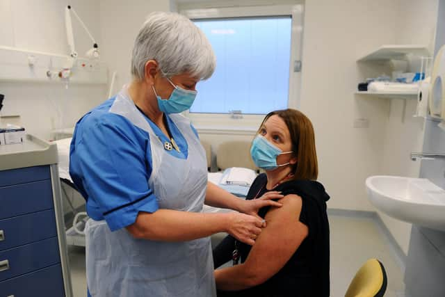 A nurse administers a Covid vaccine at a hospital. Picture: Michael Gillen