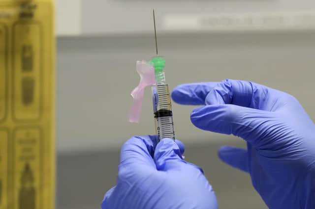 Senior Clinical Research Nurse Ajithkumar Sukumaran prepares the Covid-19 vaccine to administer to a volunteer at a clinic in London AP Photo/Kirsty Wigglesworth