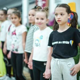 Refugees living in temporary accommodation, like these girls who are housed on a cruise ship in Edinburgh, have started moving into refurbished social housing in Wishaw.