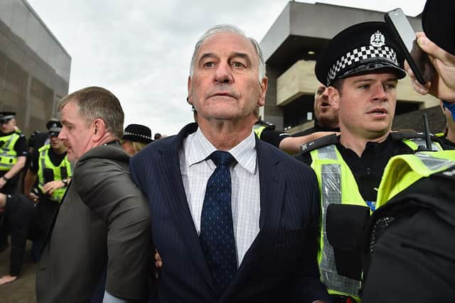 Former Rangers chief executive Charles Green leaves court surrounded by police on September 2, 2015 in Glasgow, Scotland. Photo by Jeff J Mitchell/Getty Images)